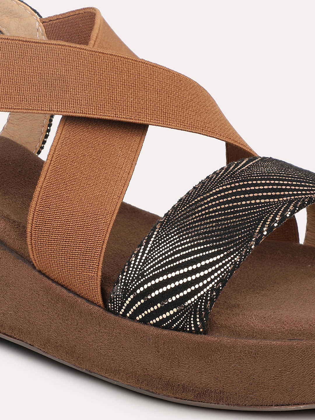 Close-up of women’s antique textured wedge sandals with criss-cross straps by INC5