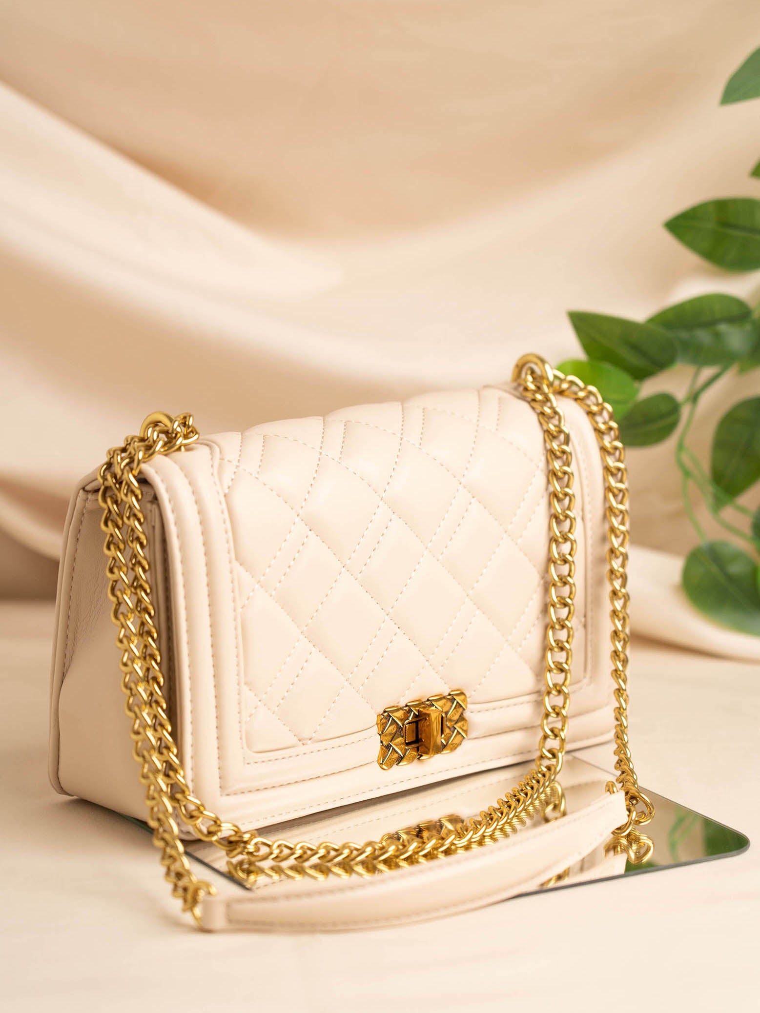 Buy Now Women Off White Structured Chain Sling Bag with Quilted Detailing