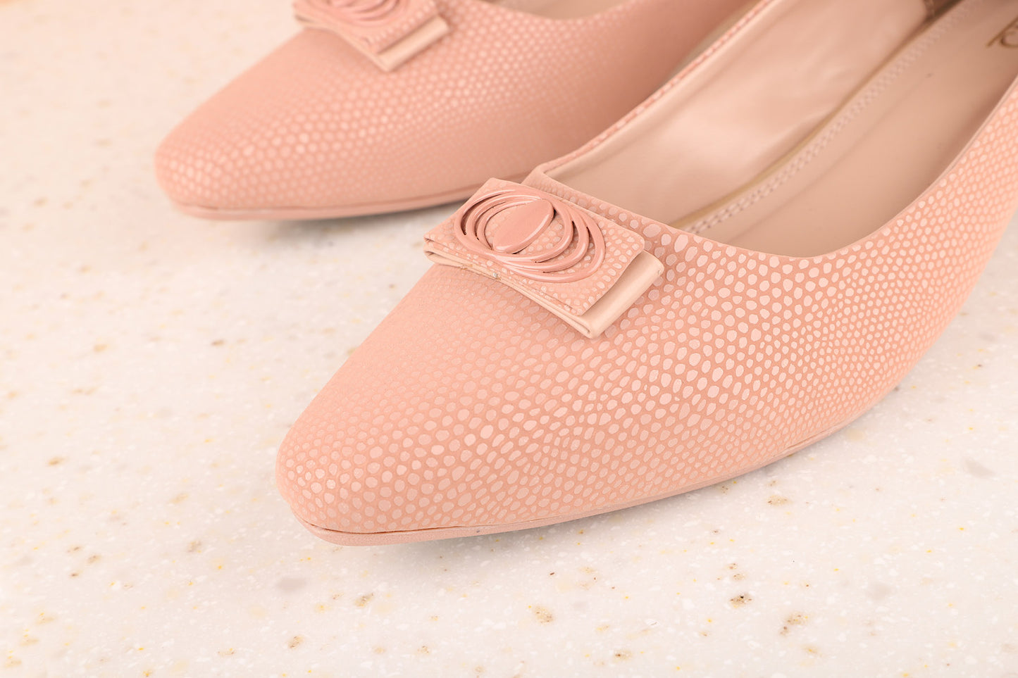 Women Pink Textured Pumps with Bows