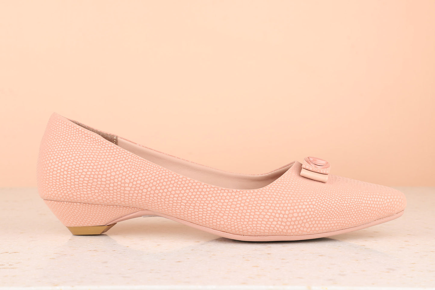 Women Pink Textured Pumps with Bows